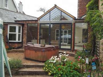 Mr & Mrs E, West Kirby, Wirral : Centor C1 double glazed Bi-fold doors with marine finish. With a combination Allstyle gable ended double glazed point. Aluminium spared ATS roof system with double glazed celsius glass. Example of aluminium triple glazed bi-fold doors. Aluminium bi-fold doors near Macclesfield SK11. Alumnus doors with 44mm triple glazing near Alderly Edge SK9. Aluminium Bi-fold doors near Wirral CH48 CH60. Alumnus Bi-fold doors triple glazed Liverpool Formby L37 near South Port PR8 Bi-fold doors near Crosby L23